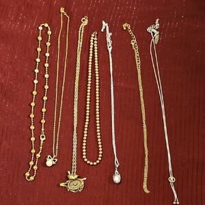7 Assorted Gold and Silver Necklaces